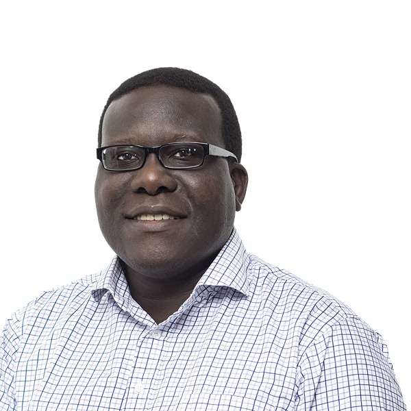 Headshot of Jidé Afolabi in glasses and blue striped shirt