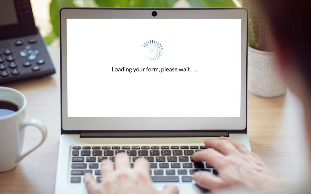 preloader with cognito forms logo and "loading your form, please wait . . ." on a white computer screen
