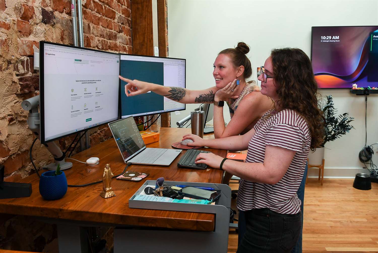 Developers working together on computer in office