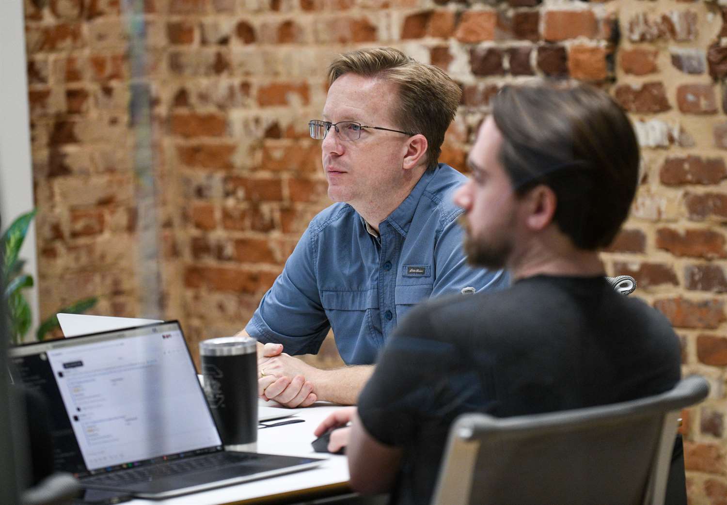 Jamie Thomas sitting in a developer meeting