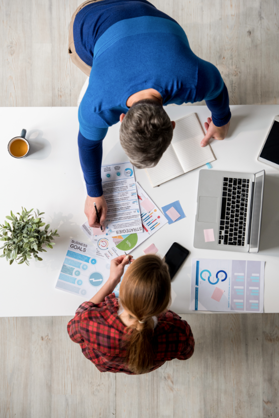 Two members of a marketing team working together.