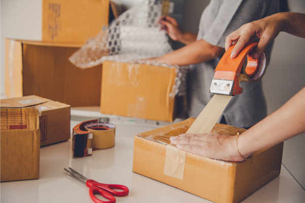 Staff packing online orders for shipping.