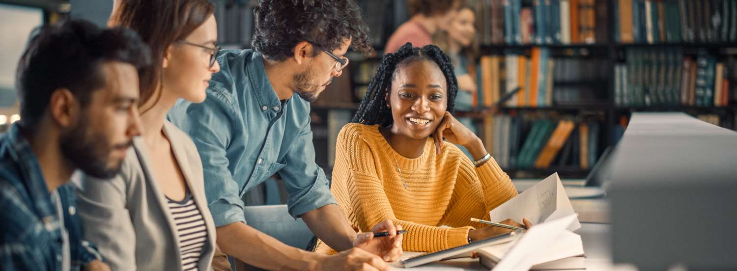A group of students studying in a library.