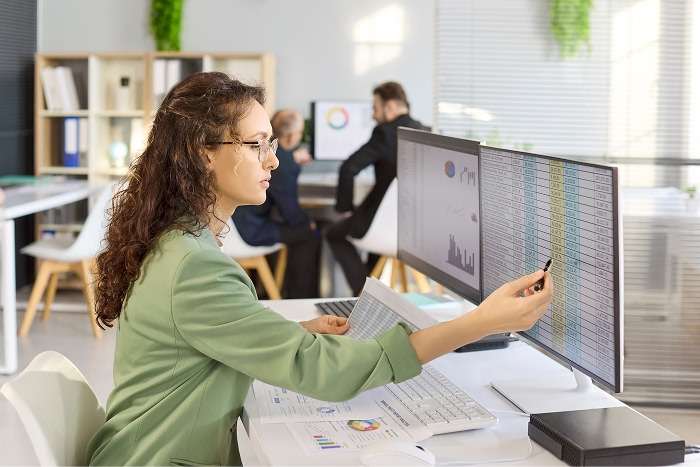 photo of woman working on data entry on computer.png