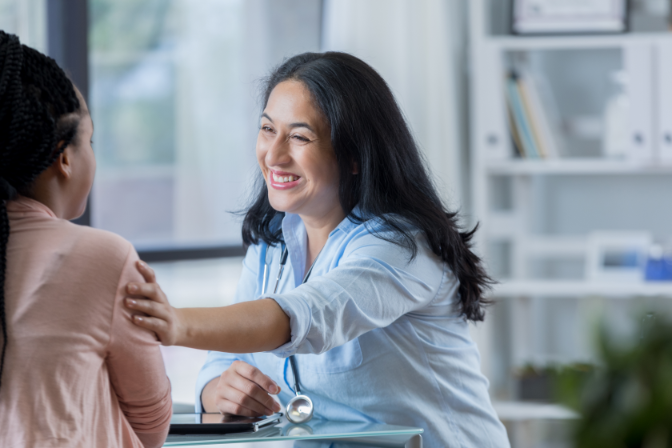 caring doctor comforts young patient