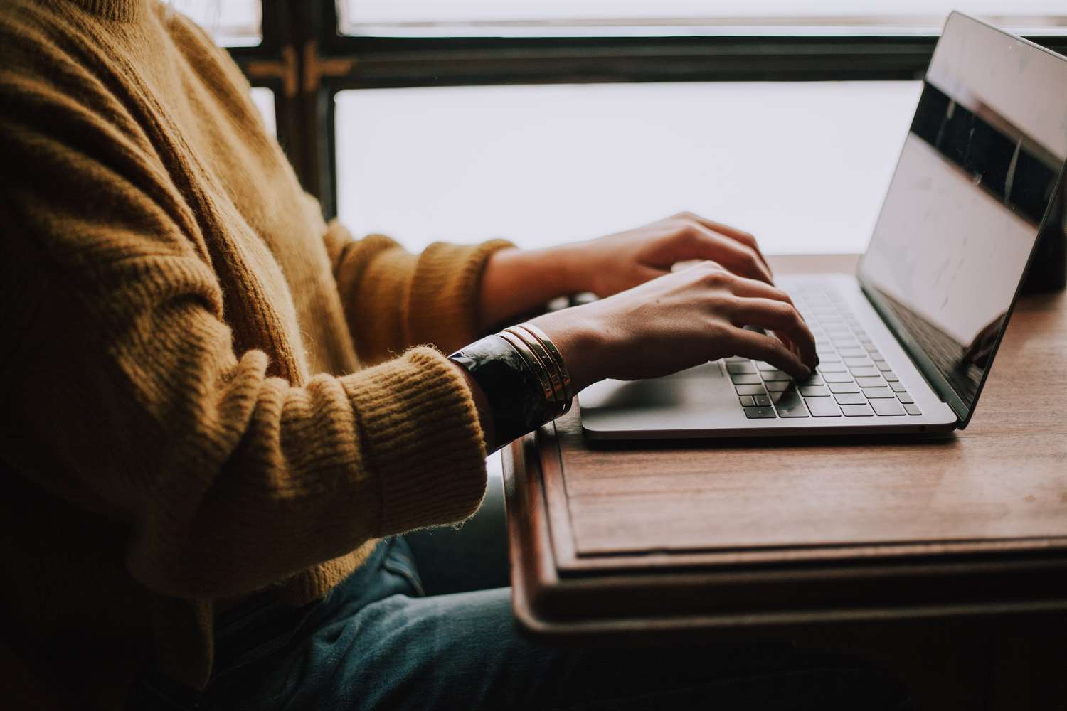 Person on laptop using Cognito Forms online form builder.