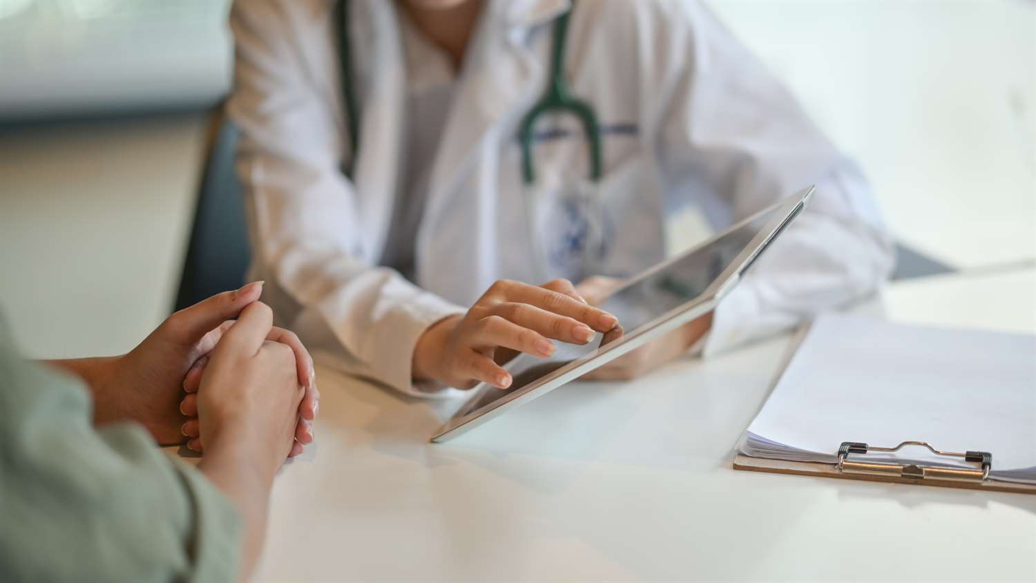 doctor reviewing online medical form with patient