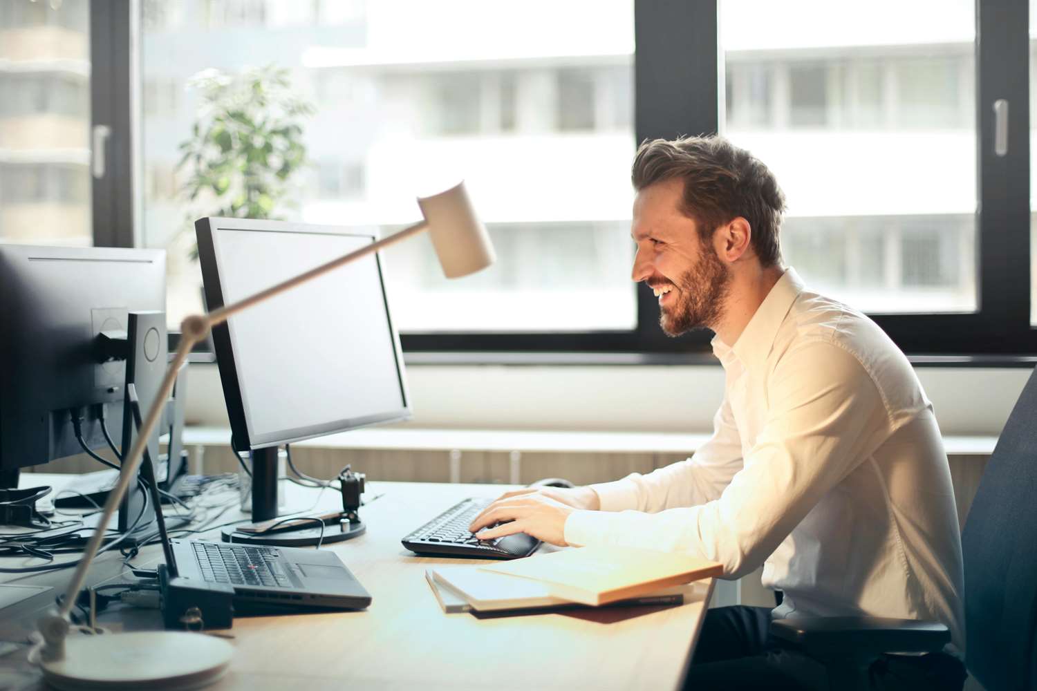 man filling patient intake form on computer