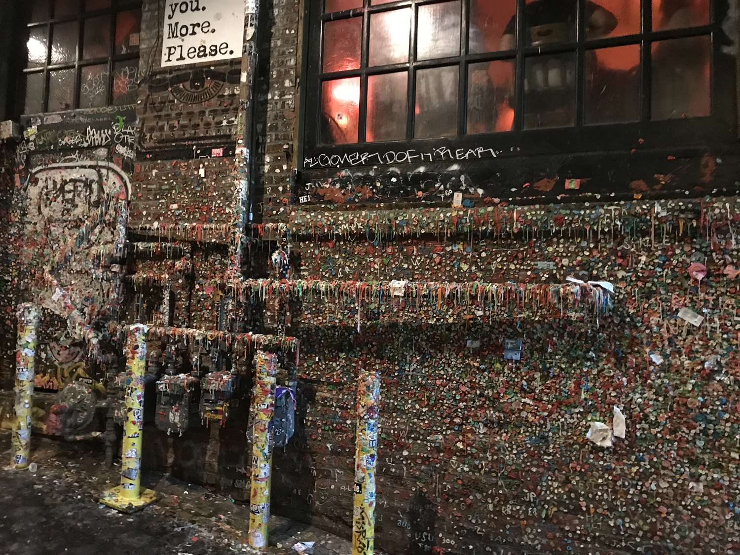 The Gum Wall - A brick wall covered in used gum situated beneath Pike Place Market in Downtown Seattle, Washington.