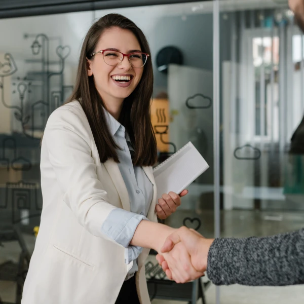 Human resource manager shaking hands with an applicant